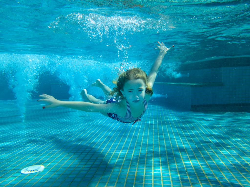 Maddie swimming underwater.