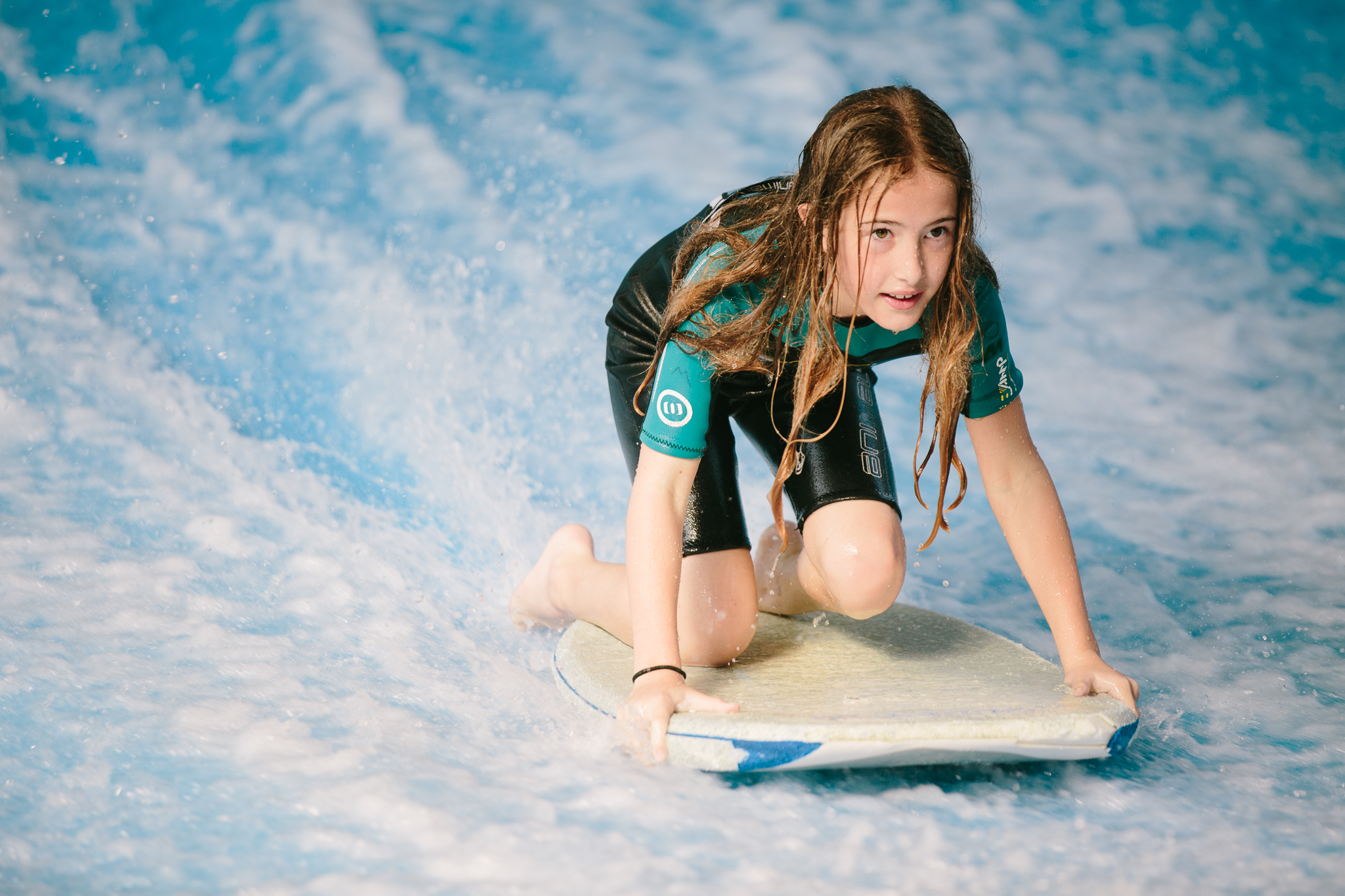 Maddie surfing on flowrider